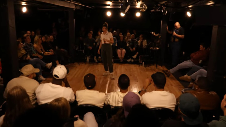 Improv Asylum performers in the intimate black box theater performing their late night show, Raunch