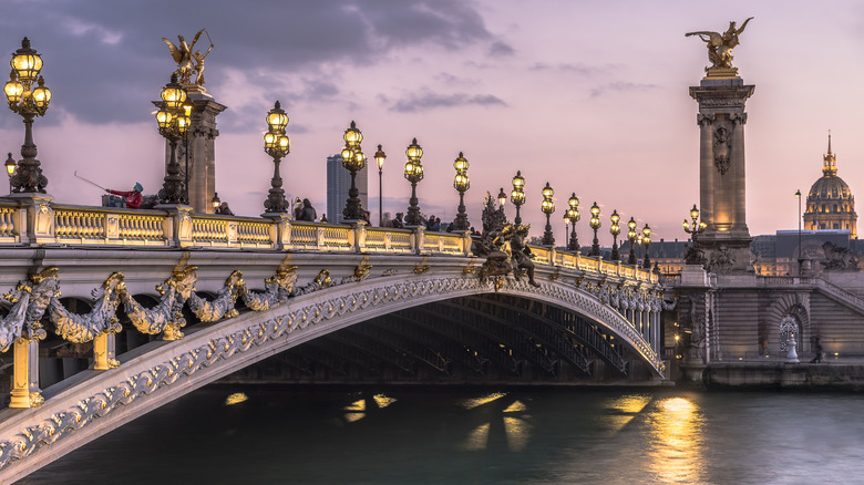 Pont Alexandre III bridge over the Seine River at dusk