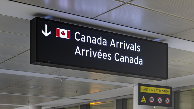 "Canada Arrivals" sign in an airport