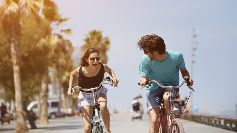 Man on Woman riding bikes 