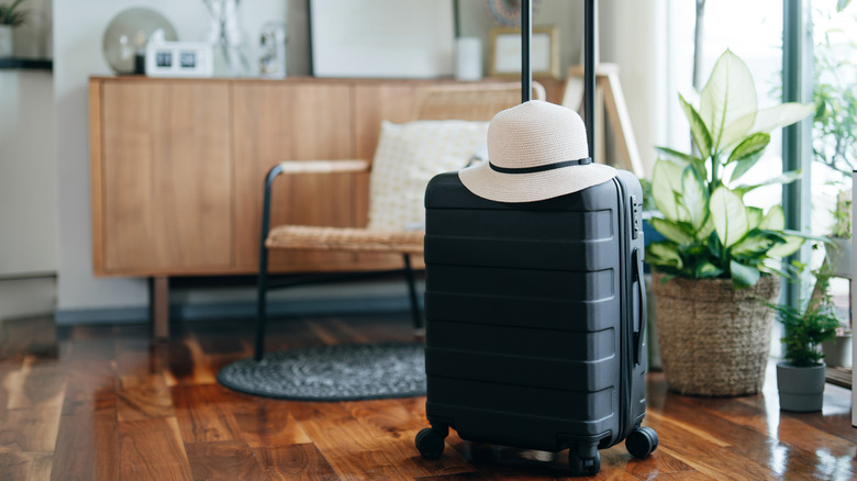 Luggage in an Airbnb shortly after arriving at the property