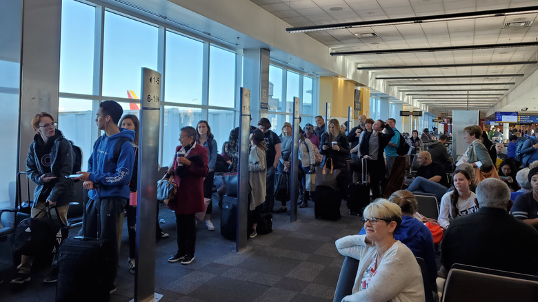 People line up at boarding gate