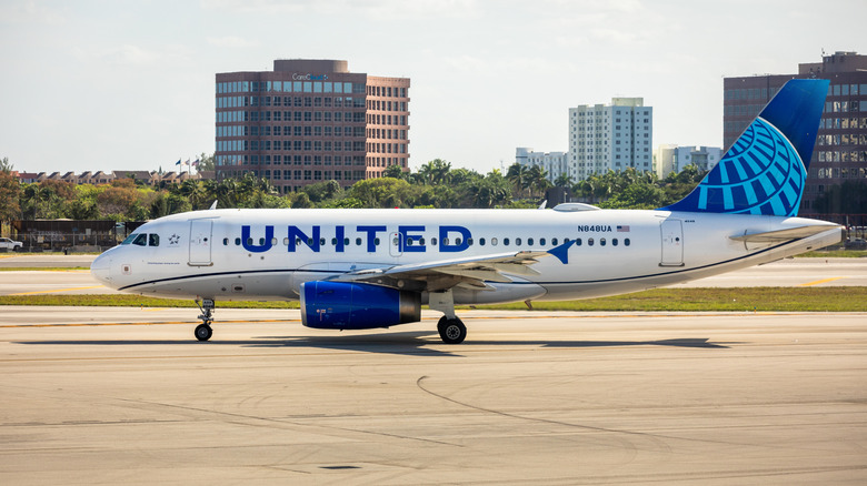United Airlines plane taxis at Miami International Airport