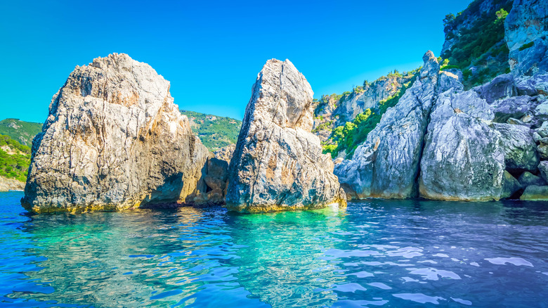 The rugged coastline and blue caves of Paleokastritsa, Corfu, Greece