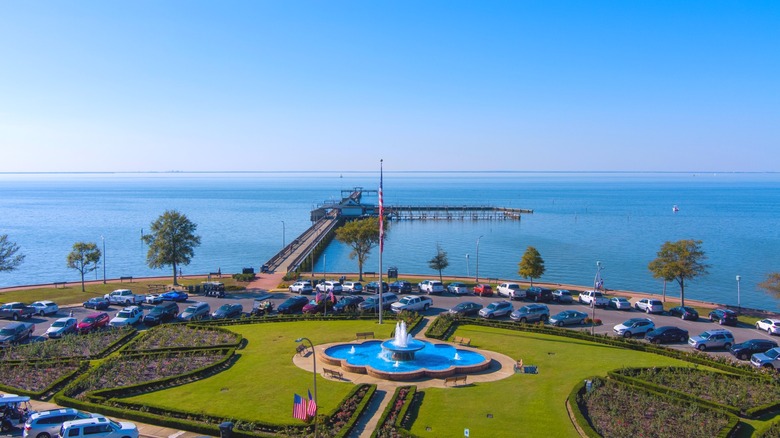 An aerial view of the Fairhope pier with a small greenspace and a fountain