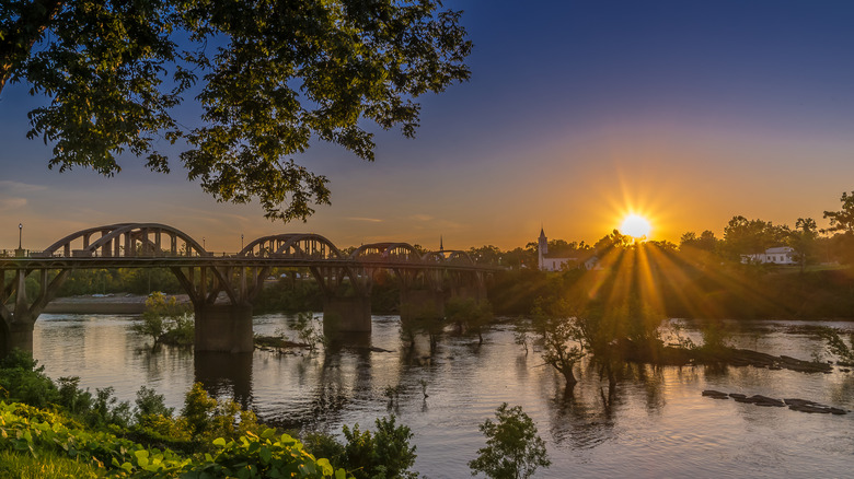 The sun sets over Wetumpka with the Bibb Graves Bridge in the foreground.