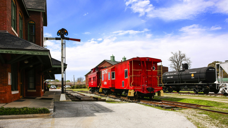 Train exhibits outside of the Tuscumbia Railroad Depot museum