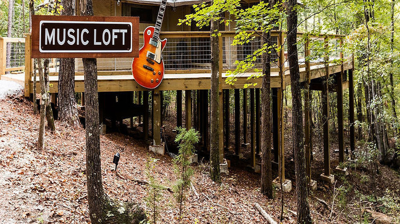 Music Loft glamping tent with big guitar on the front at The Destination Glamping Resort in Dadeville, Alabama