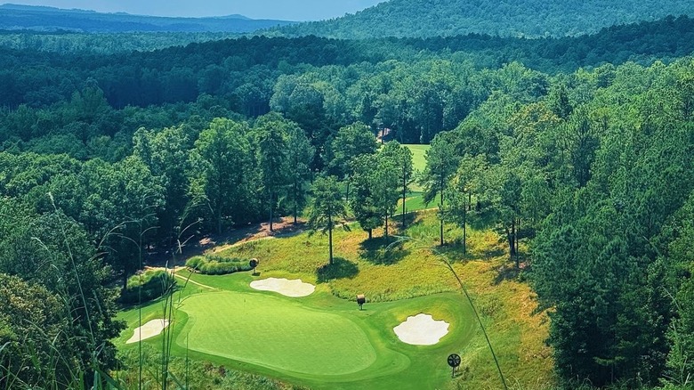 Golf course with mountains in background