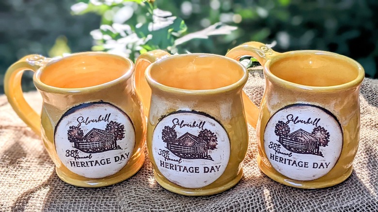 Yellow mugs reading 