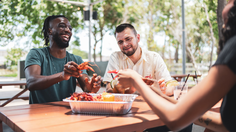 A group of friends enjoying seafood together