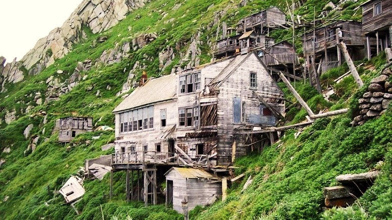 Houses on wooden stilts on rocky island