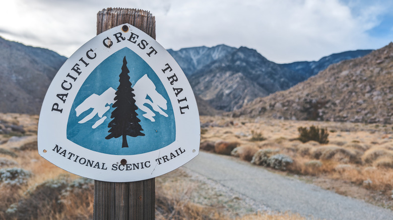 Pacific Crest Trail signpost at Snow Creek, with the San Jacinto Mountains in the background