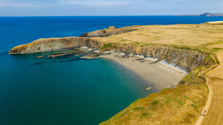 A big beach surrounded by high coastal hills in the Pembrokeshire Coast National Park