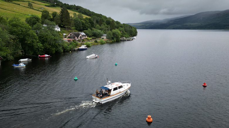 A boat sailing over Loch Ness near Drumnadrochit, Scotland
