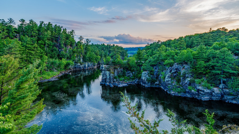 Trees and rocky cliffs along the St. Croix River in Interstate State Park in Wisconsin