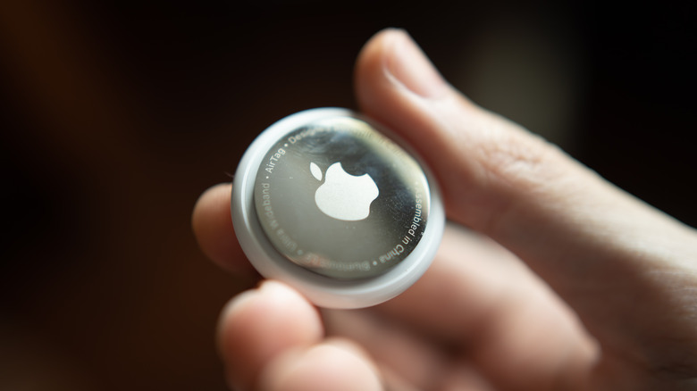 Person holding an AirTag