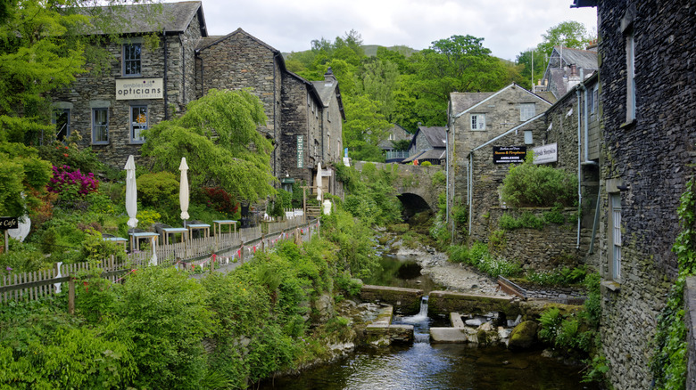 Cottages converge on a riverway in the village of Ambleside