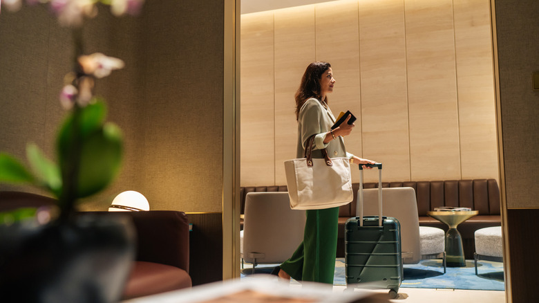 Traveler walking through an airport lounge