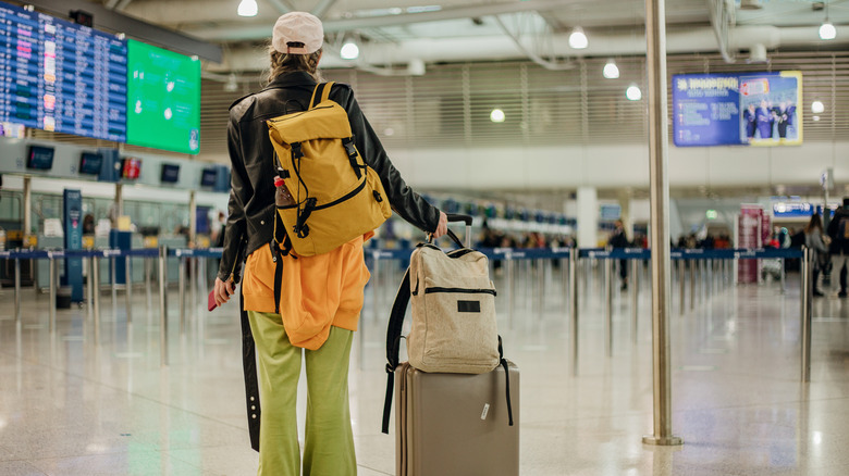 Passenger with luggage at the airport