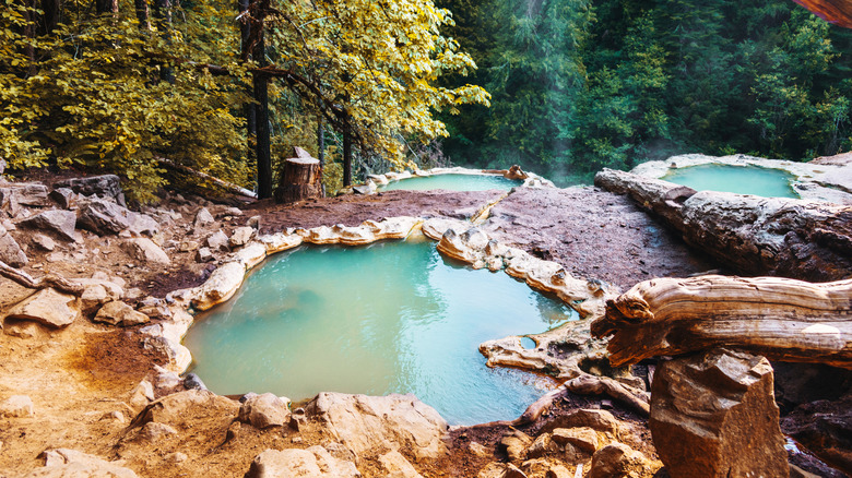 A man relaxing in the Umpqua Hot Springs, Oregon
