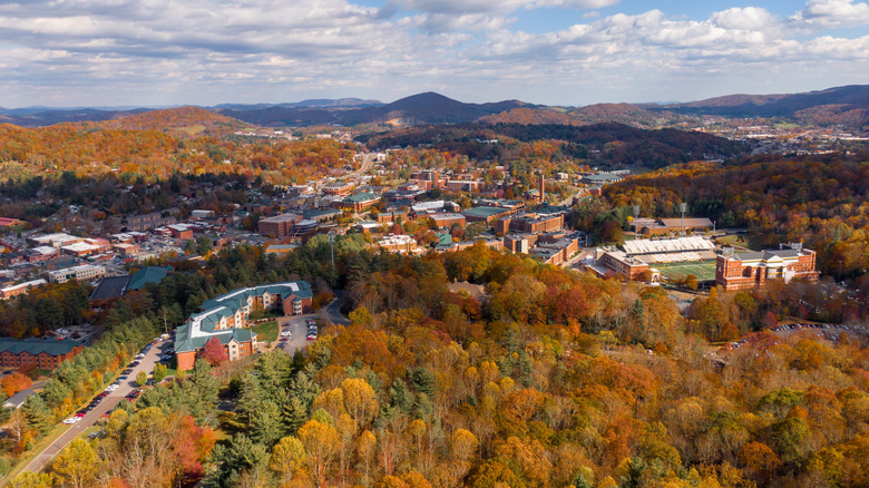 An aerial view in the autumn of Boone, North Carolina, with mountains in the background
