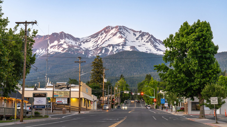 A main thoroughfare in the town of Mt. Shasta, California, with a snow-capped mountain in the background