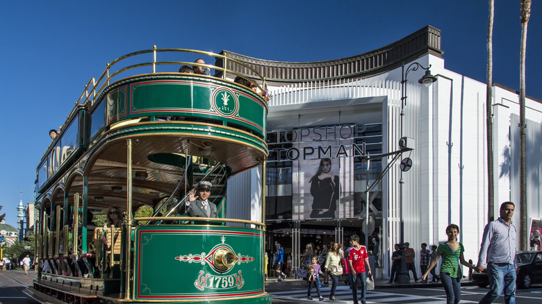 A green double-decker trolley at The Grove.
