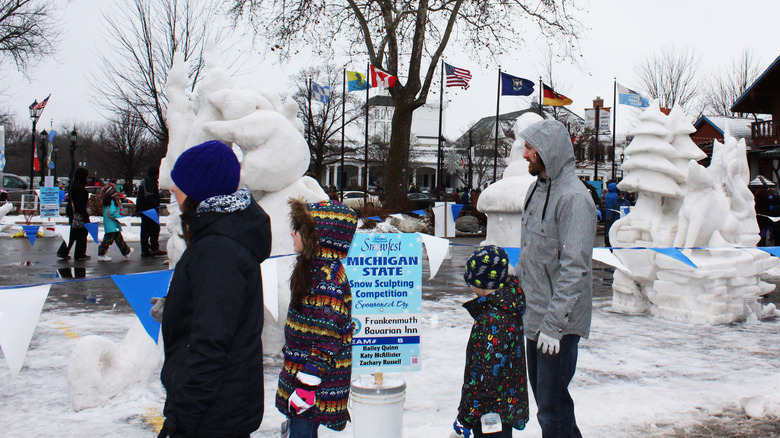Visitors admiring snow sculptures at Zehnders Snowfets