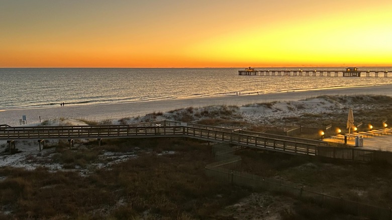 Sunset over the beach and boardwalks at Gulf State Park in Alabama