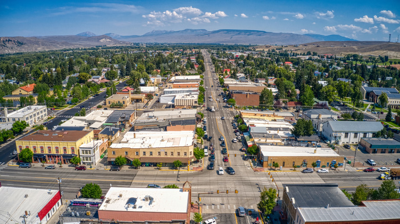 An aerial view of downtown Gunnison, Colorado, with mountains in the distance