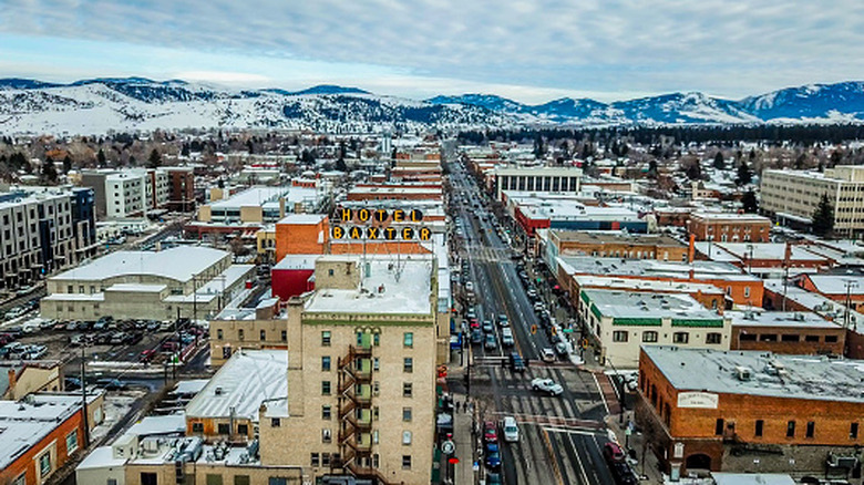 An aerial view of downtown Bozeman, Montana, in the winter, with mountains in the background