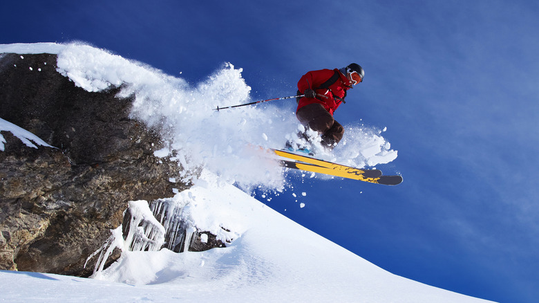 Skier jumping on mountain