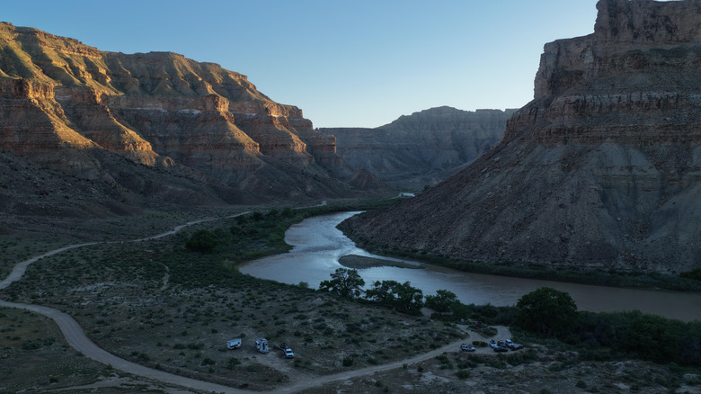 Aerial view at dusk of RVs camped along the Green River in Desolation Canyon, Utah.
