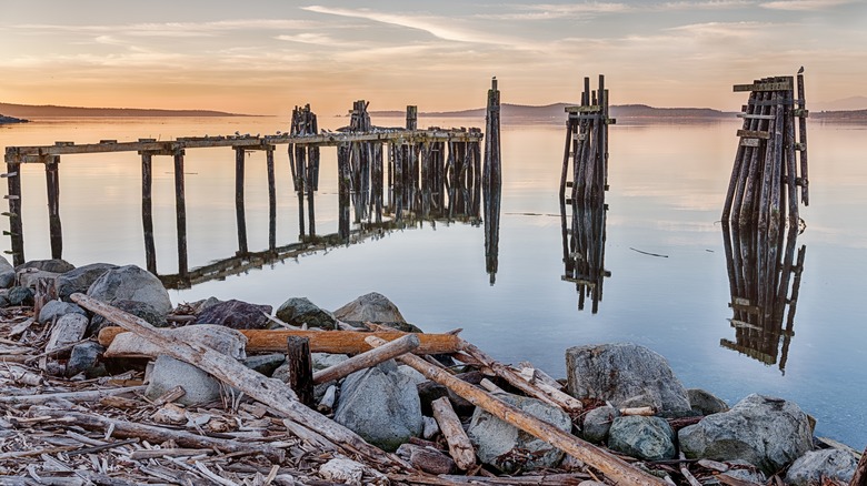 Sunrise over an old fishing pier at Jackson Beach on San Juan Island, Washington