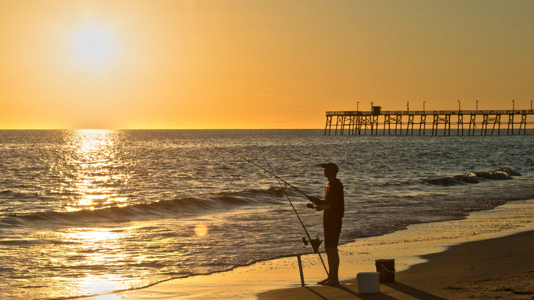 A man surf fishes in North Carolina's Outer Banks