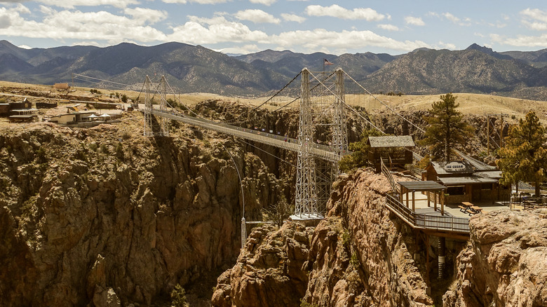 A bridge crosses a red-rock gorge in Colorado