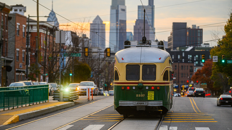 Trolley car in Philadelphia with skyline in background