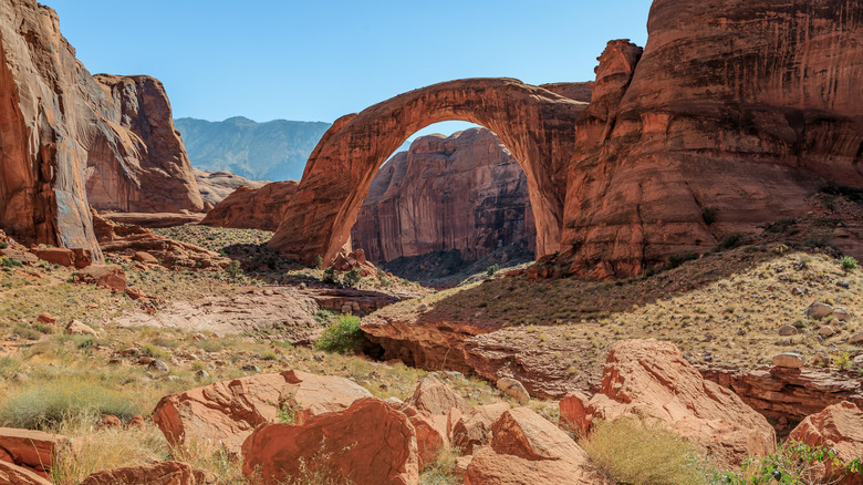 Rainbow Natural Bridge surrounded by red rock landscape in Utah