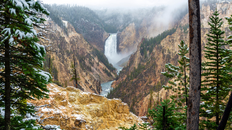 The steep walls and snow-dusted rocks of the Grand Canyon of Yellowstone
