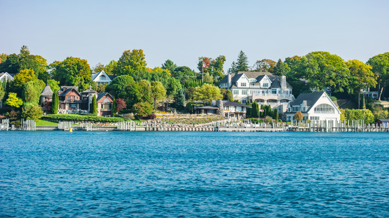 Houses sit on the side of a lake in Michigan