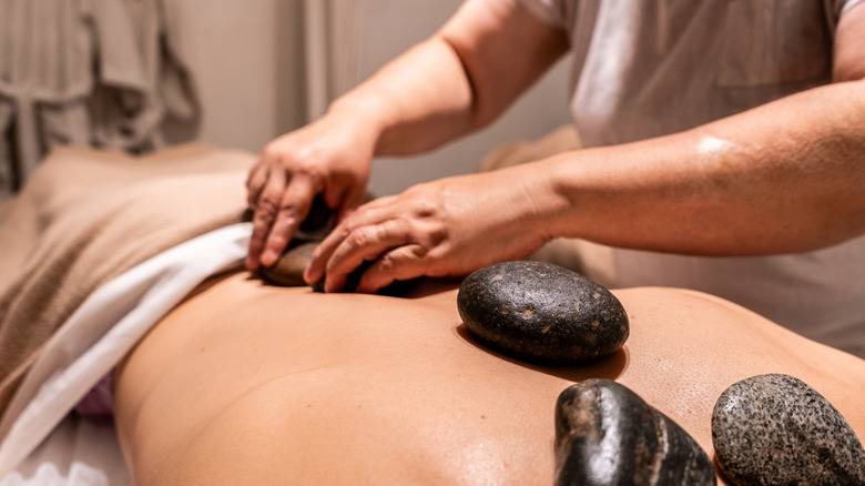 Person getting a hot stone massage