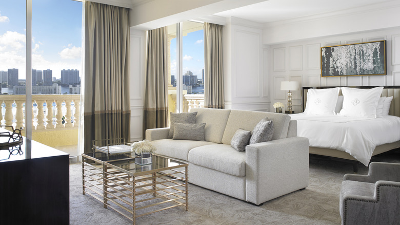 Interior of a hotel suite with water view and terrace at Acqualina Resort in Miami, Florida