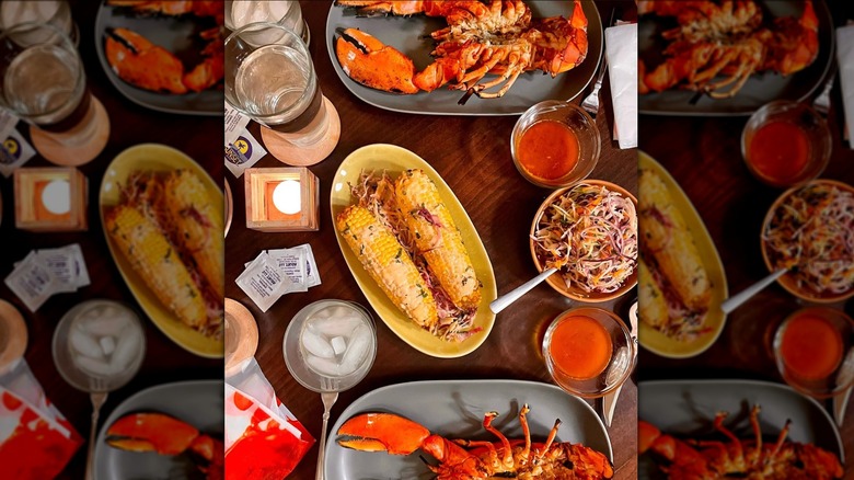 Overhead shot of lobsters on wooden table
