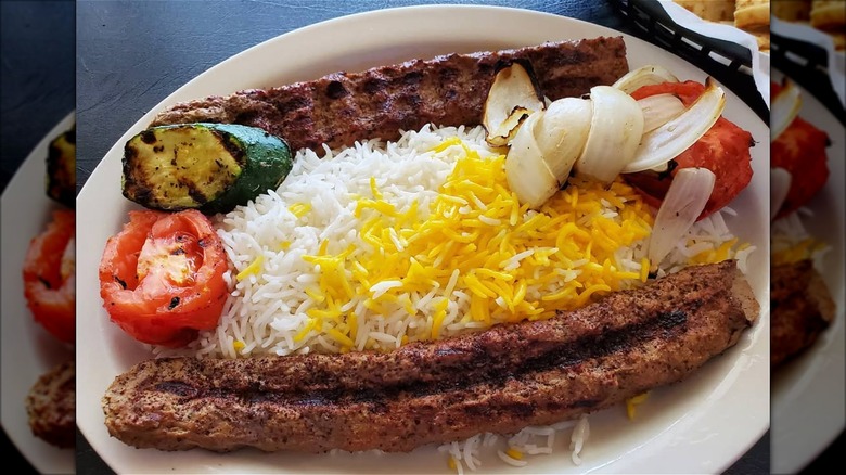 Chelo Kabob plate with rice, meat, and vegetables