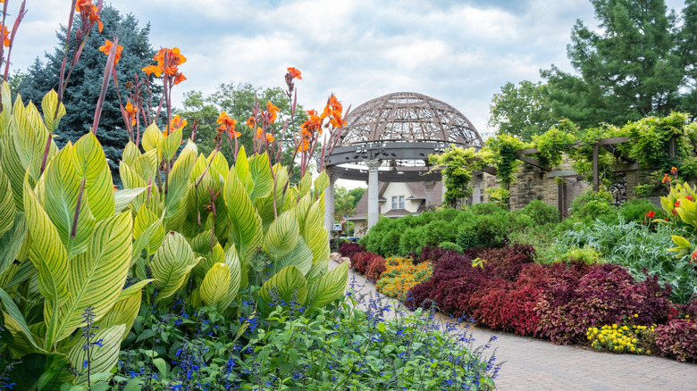 Domed gazeba surrounded by colorful flowers and lush plants in the Sunken Gardens in Lincoln, Nebraska