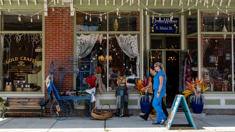 Women walking past a storefront on Main Street, Berlin, Maryland