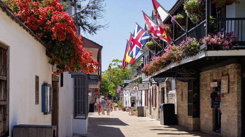 sunny day with people strolling on St Augustine street