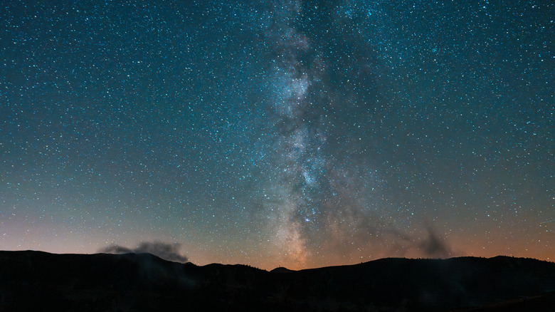 The Milky Way over a series of mountains as see at night