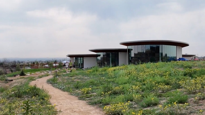 People hiking outside the Anythink Nature Library in Thornton, Colorado